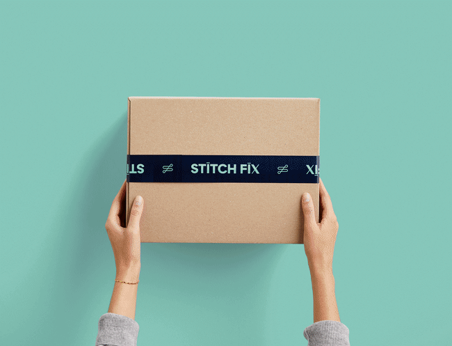 Stitch Fix shipment box with Stitch Fix men's clothing items including shoes, shirt, button-down and pants.
