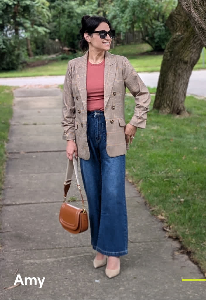 Woman wearing Stitch Fix clothing including black trench coat, sweaterdress and brown boots.