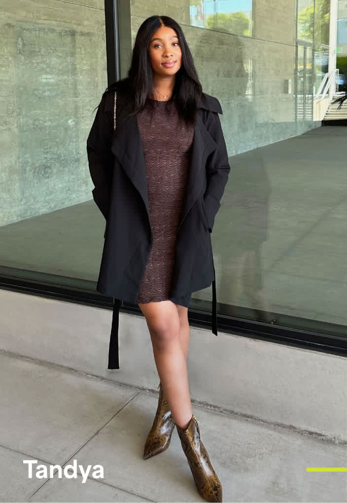 Woman wearing Stitch Fix clothing including brown blazer, pink tee and wide-leg denim.