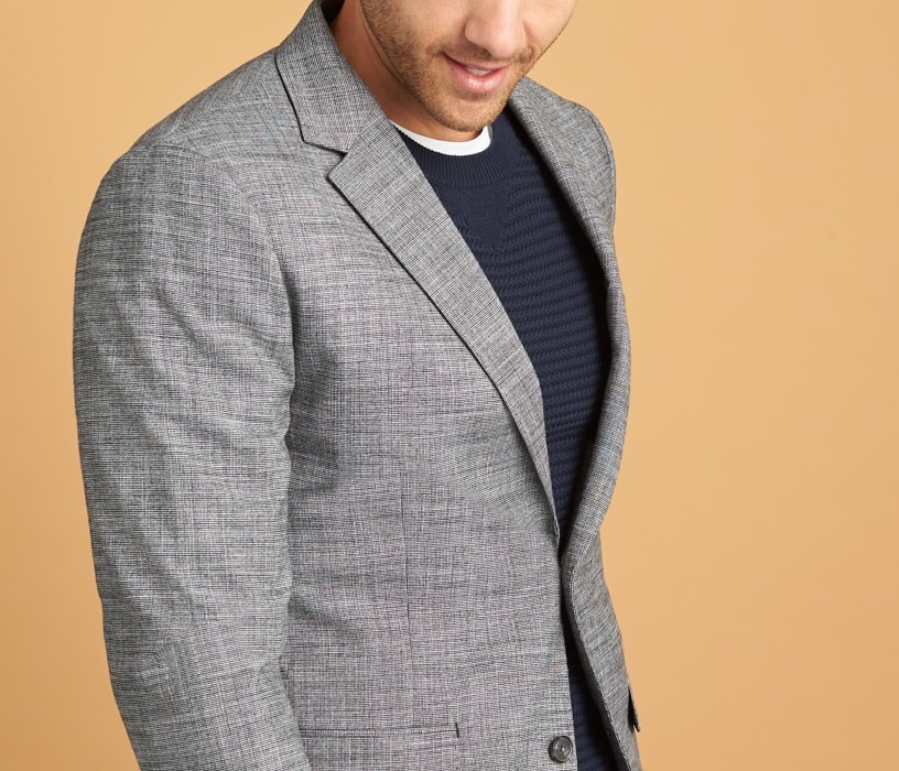 Blue and black striped shirt with grey blazer.
