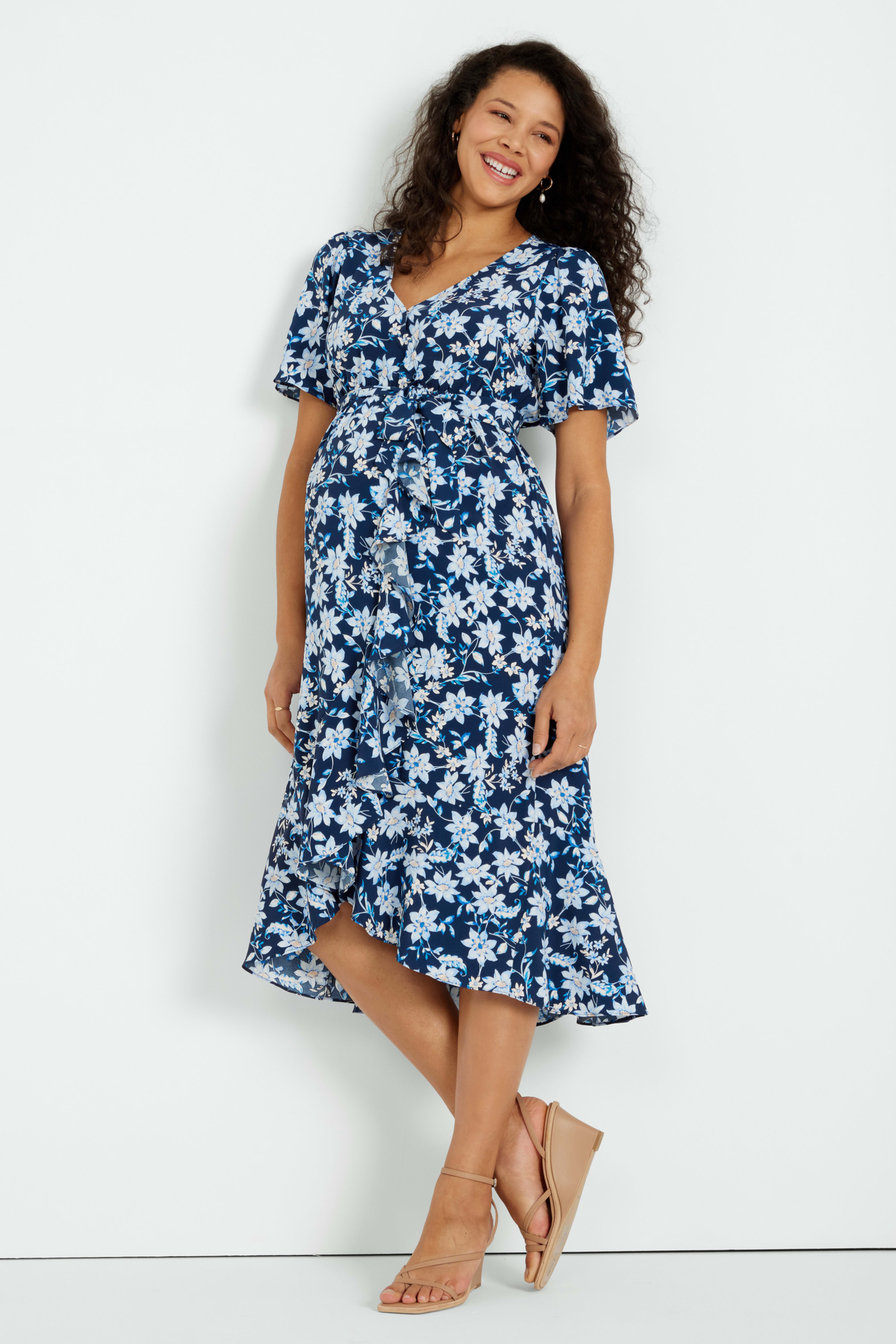 Pregnant woman in floral print Stitch Fix maternity dress and espadrille sandals
