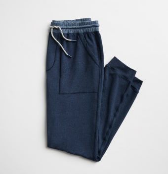 Men’s jogger pants in navy blue with drawstring closure.