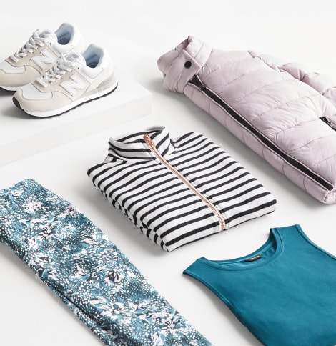 Activewear outfit including white sneakers and puffer jacket, black and white zip up, blue floral pants and a teal tank.