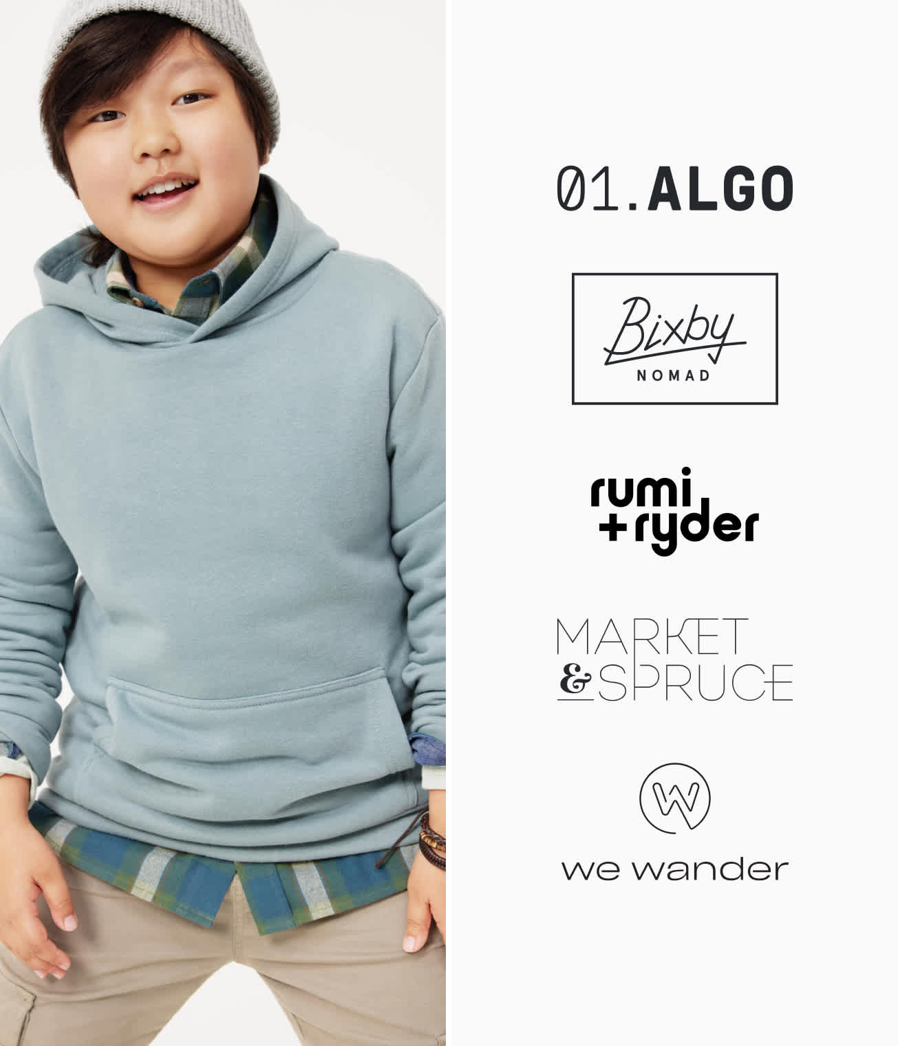 Model wearing Stitch Fix kid’s clothing including blue hoodie and green flannel.