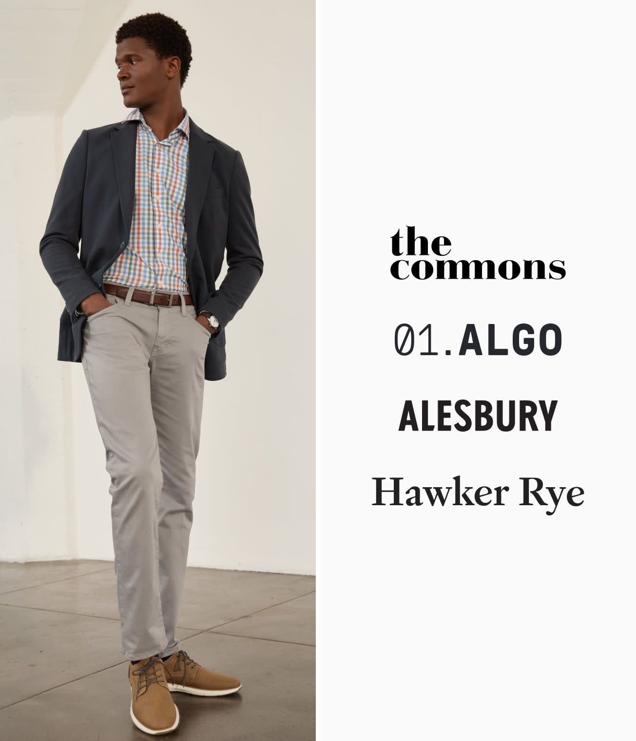 Model wearing Stitch Fix men’s clothing including navy blazer, colorful button-up shirt, gray pants and loafers.